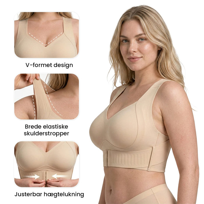 Beige Trueform-BH med V-udskæring, brede stropper og lukning foran.