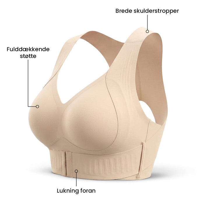 Beige Trueform-formende BH uden bøjle, sømløs med lukning foran, brede skulderstropper og fuld dækning.